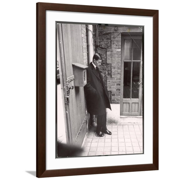 Art.com Christian Dior's Successor Yves Saint Laurent Standing Alone After Attending Dior's Funeral Photographic Print by Loomis Dean, Brown Frame Wall Art, 32" x 40"