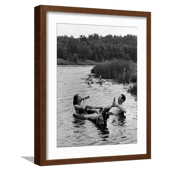 Art.com Couple Drinking Beer at Inner Tube Floating Party on the Apple River Photographic Print by Alfred Eisenstaedt, Brown Frame Wall Art, 17" x 21"