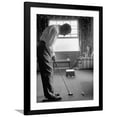 thumbnail image 1 of Art.com Golfer Ben Hogan Practicing Putting in His town house with Wife Valerie Watching from Armchair Premium Photographic Print by Loomis Dean, Black Frame Wall Art, 32" x 40", 1 of 5