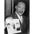 Martin Luther King Holding Photographs of Three Murdered Civil