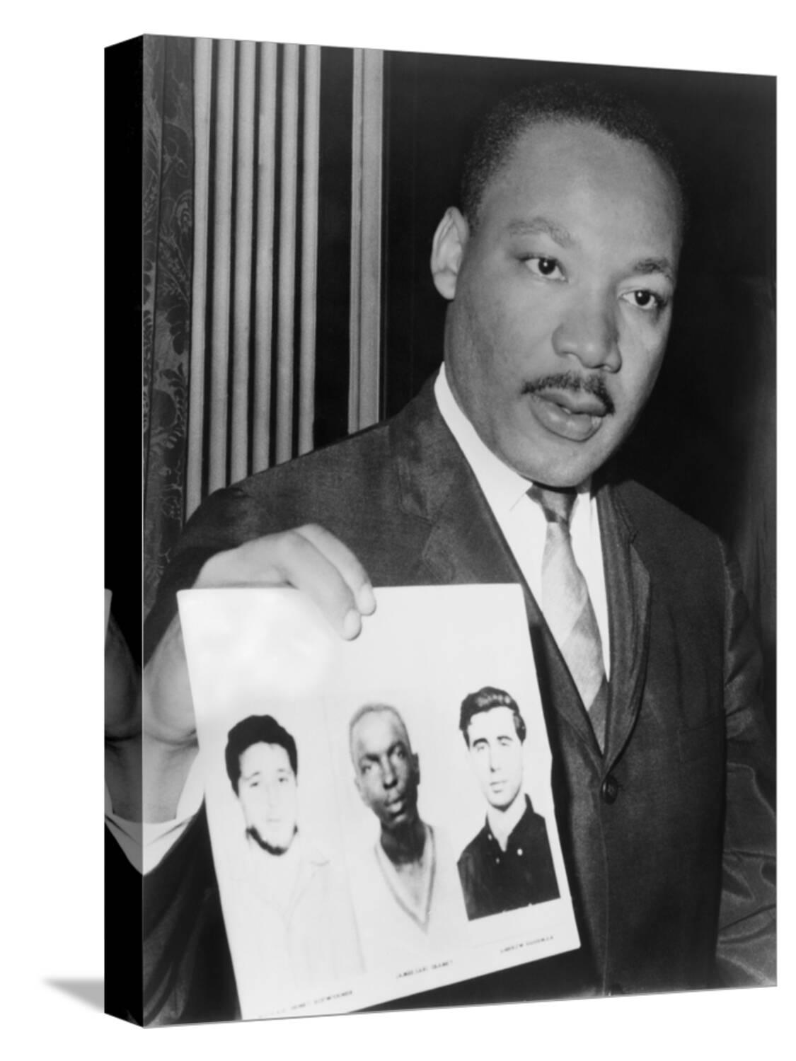 Martin Luther King Holding Photographs of Three Murdered Civil