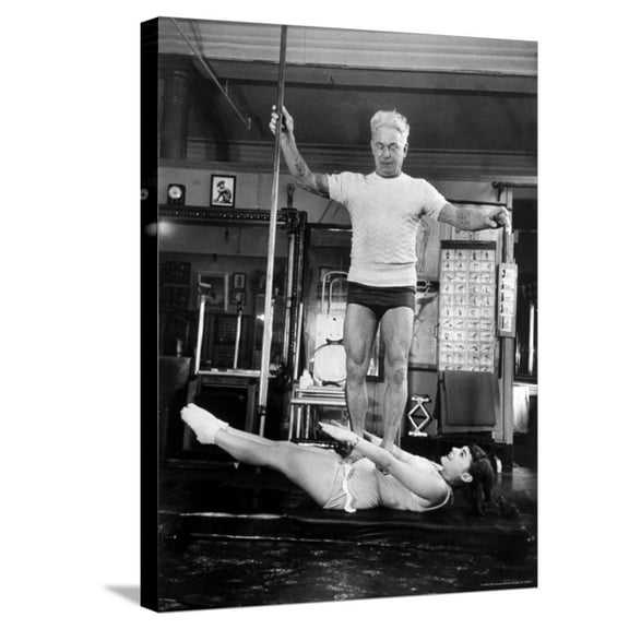 Art.com Opera Singer Roberta Peters Balancing Her Trainer, Joseph Pilates, on Her Operatic Breadbasket Stretched Canvas Print Wall Art by Michael Rougier, 18" x 24"