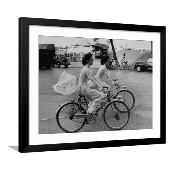Art.com Women Riding Bicycles in Saigon Photographic Print by John Dominis, Black Frame Wall Art, 40" x 32"