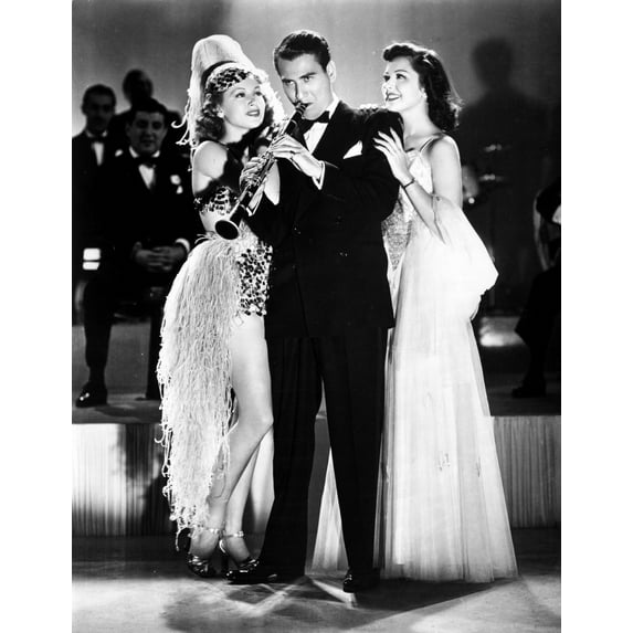 Artie Shaw Playing Flute with Two Girls in Both Side Photo Print (24 x 30)