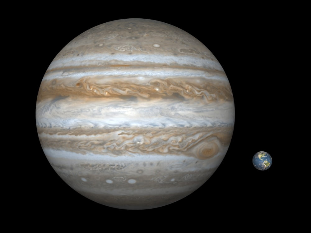 Artists concept comparing the size of the gas giant Jupiter with that of the Earth Canvas Art - Walter MyersStocktrek Images (17 x 13)