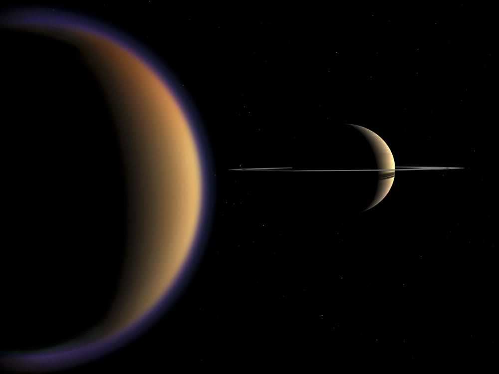 Artists concept of Saturn and its moon Titan Canvas Art - Walter MyersStocktrek Images (17 x 13)