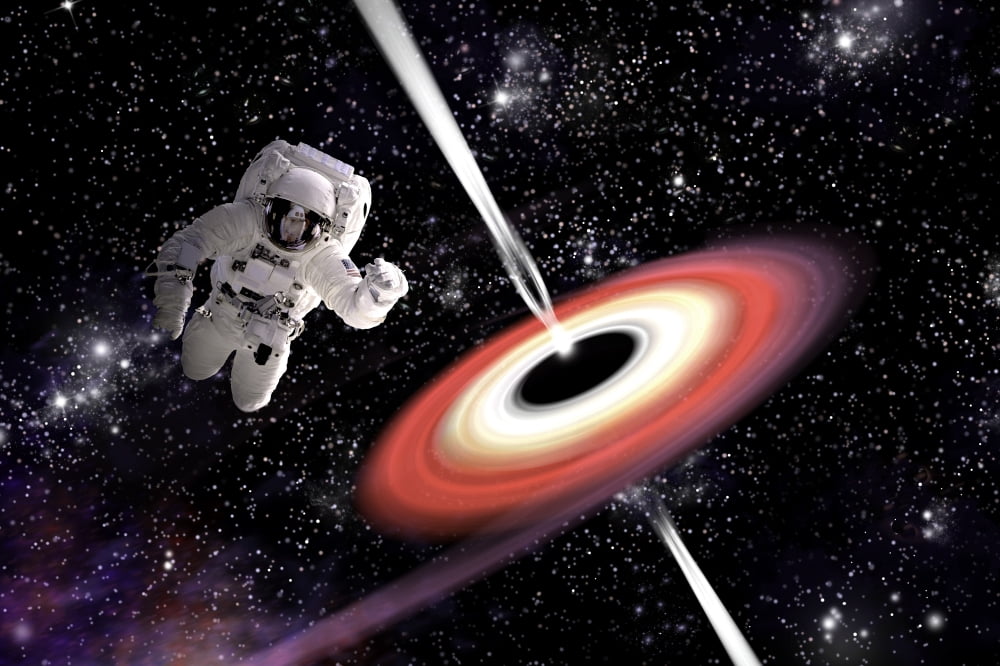 Artists concept of an astronaut falling towards a black hole in outer space Canvas Art - Marc WardStocktrek Images (17 x 12)