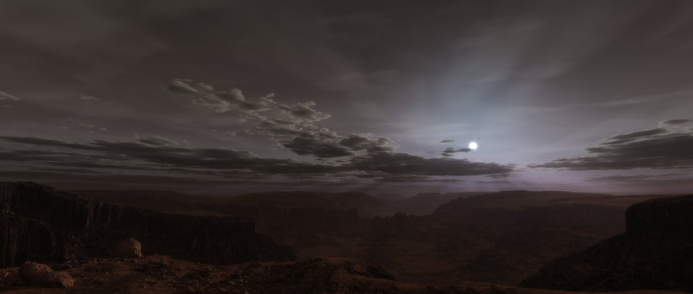 Artists concept of the Sun rising over Valles Marineris on Mars Canvas Art - Frieso HoevelkampStocktrek Images (22 x 10)