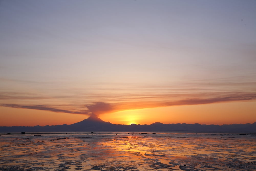 Ash Cloud Rises From Mt Redoubt At Sunset During Low Tide Near Ninilchik Alaska Canvas Art - Calvin Hall Design Pics (17 x 11)