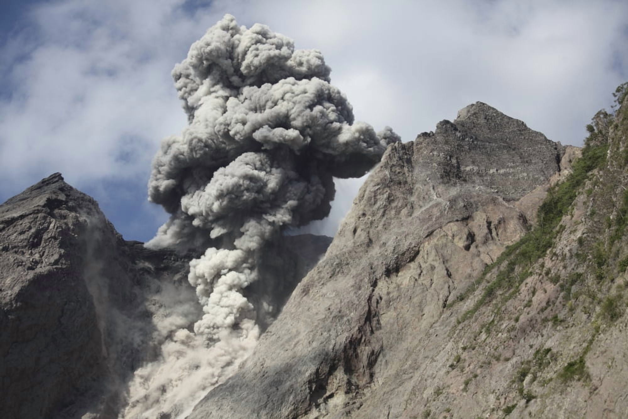 Ash cloud rises from crater of Batu Tara volcano Indonesia Canvas Art - Richard RoscoeStocktrek Images (18 x 12)