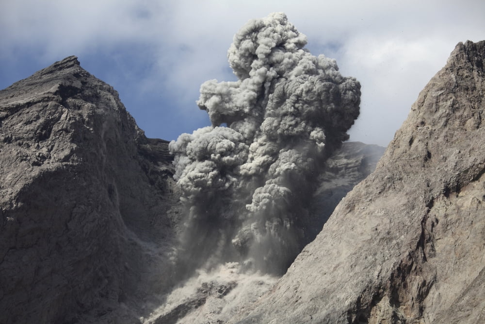 Ash cloud rises from crater of Batu Tara volcano Indonesia Canvas Art - Richard RoscoeStocktrek Images (18 x 12)
