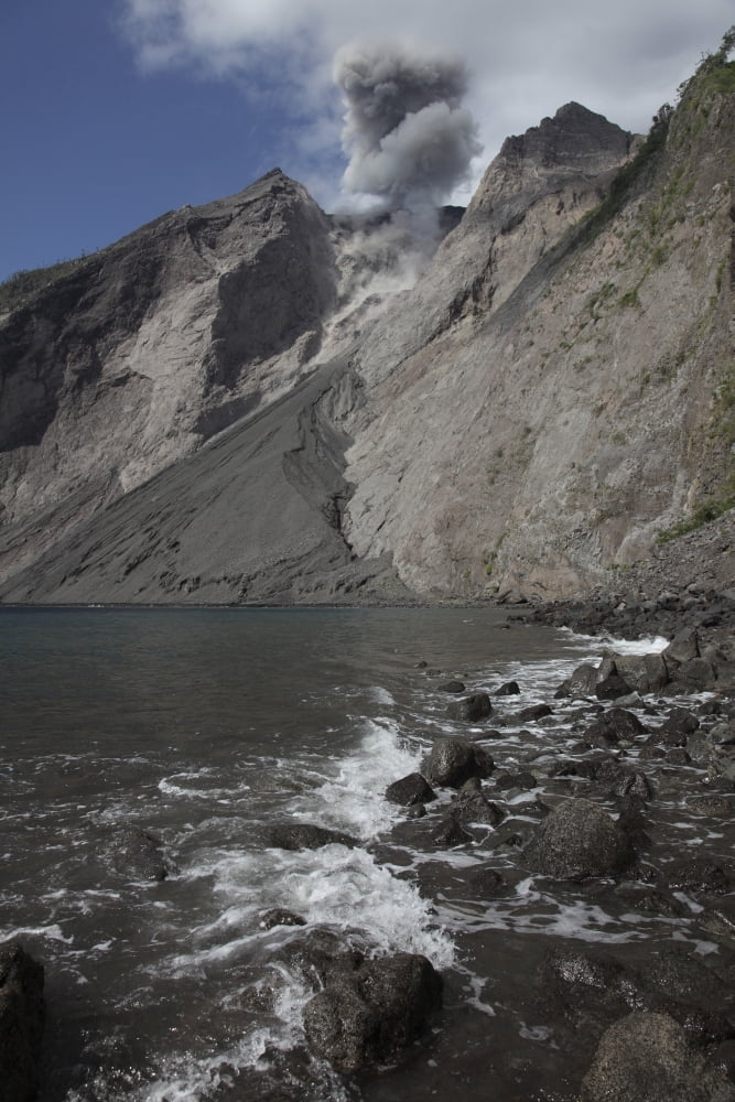 Ash cloud rises from crater of Batu Tara volcano Indonesia Canvas Art - Richard RoscoeStocktrek Images (23 x 35)