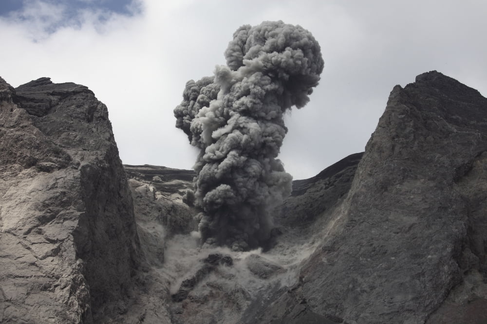 Ash cloud rises from crater of Batu Tara volcano Indonesia Canvas Art - Richard RoscoeStocktrek Images (35 x 23)