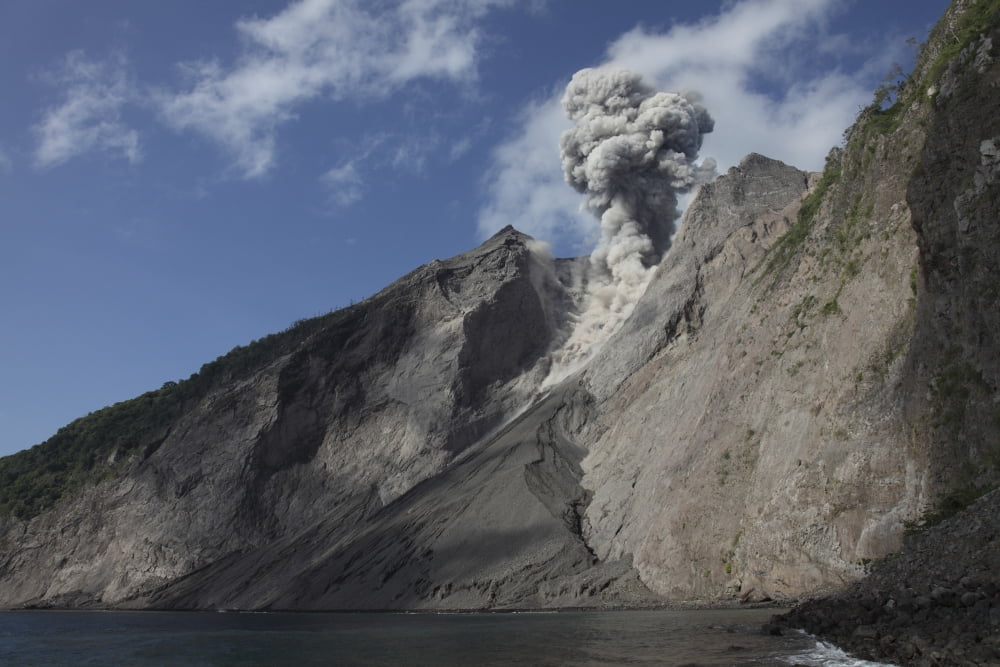 Ash cloud rises from crater of Batu Tara volcano Indonesia Canvas Art - Richard RoscoeStocktrek Images (35 x 23)