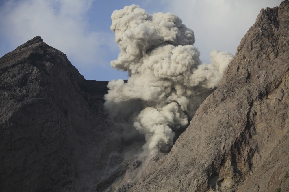 Ash cloud rises from crater of Batu Tara volcano Indonesia Canvas Art - Richard RoscoeStocktrek Images (35 x 23)
