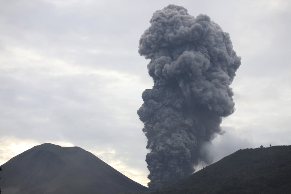 Ash cloud rising from Tompaluan crater at Lokon-Empung volcano Indonesia Canvas Art - Richard RoscoeStocktrek Images (18 x 12)