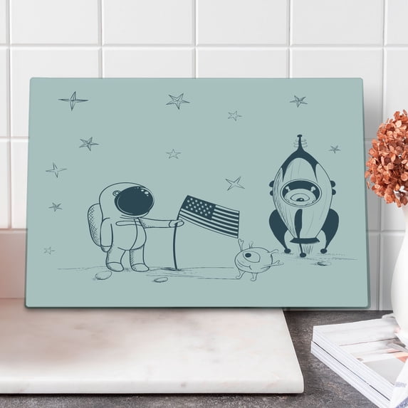 Astronaut Cutting Board, Cosmonaut with Aliens on New Planet Planting United States Flag Graphic, Decorative Tempered Glass Cutting and Serving Board, Large Size, Blue Grey Coconut, by Ambesonne