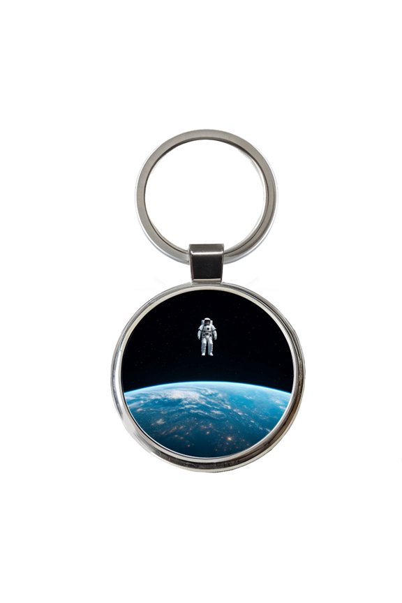 Astronaut Drifting In Space Above Earth Metal Round Keychain