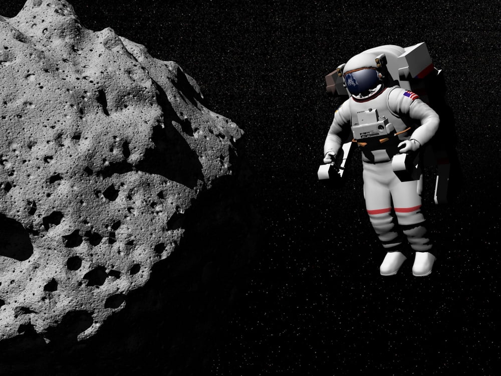 Astronaut exploring an asteroid in outer space Canvas Art - Elena DuvernayStocktrek Images (33 x 25)