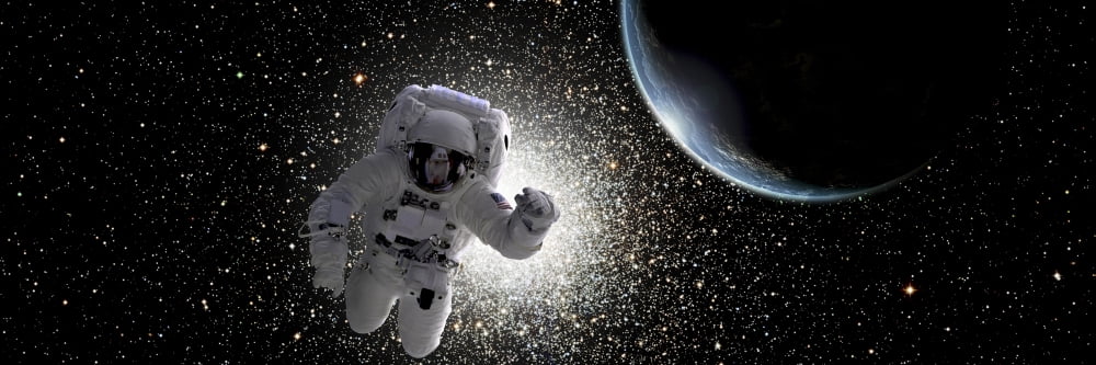Astronaut floating in deep space with an Earth-like planet in background Canvas Art - Marc WardStocktrek Images (48 x 16)