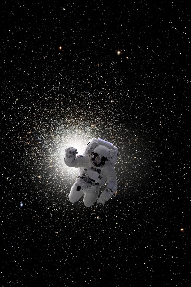 Astronaut floating in deep space with large cluster galaxy in background Canvas Art - Marc WardStocktrek Images (24 x 35)