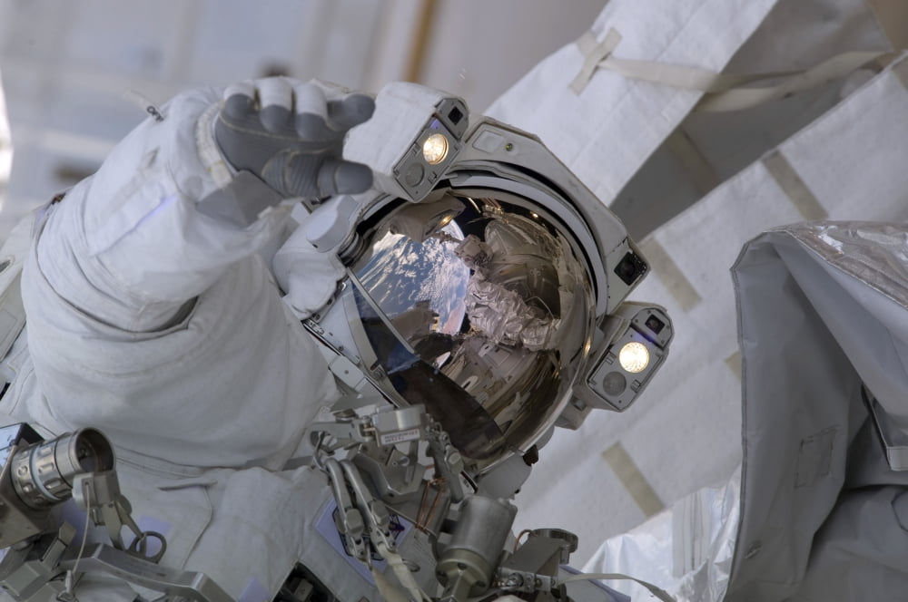 Astronaut participates in a session of extravehicular activity Canvas Art - Stocktrek Images (34 x 23)