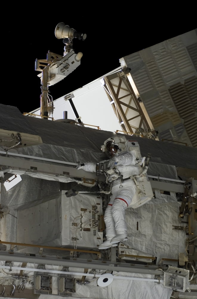 Astronaut participates in extravehicular activity Canvas Art - Stocktrek Images (23 x 34)