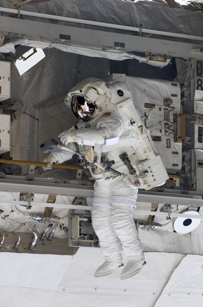 Astronaut participates in extravehicular activity Canvas Art - Stocktrek Images (23 x 34)