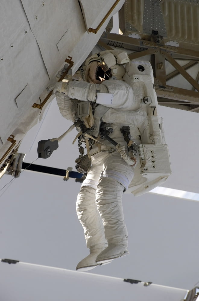Astronaut participates in extravehicular activity Canvas Art - Stocktrek Images (23 x 34)