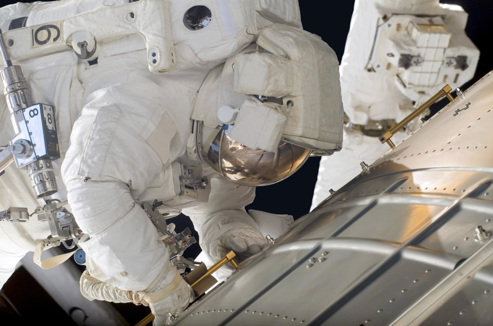 Astronaut participates in extravehicular activity Canvas Art - Stocktrek Images (34 x 23)