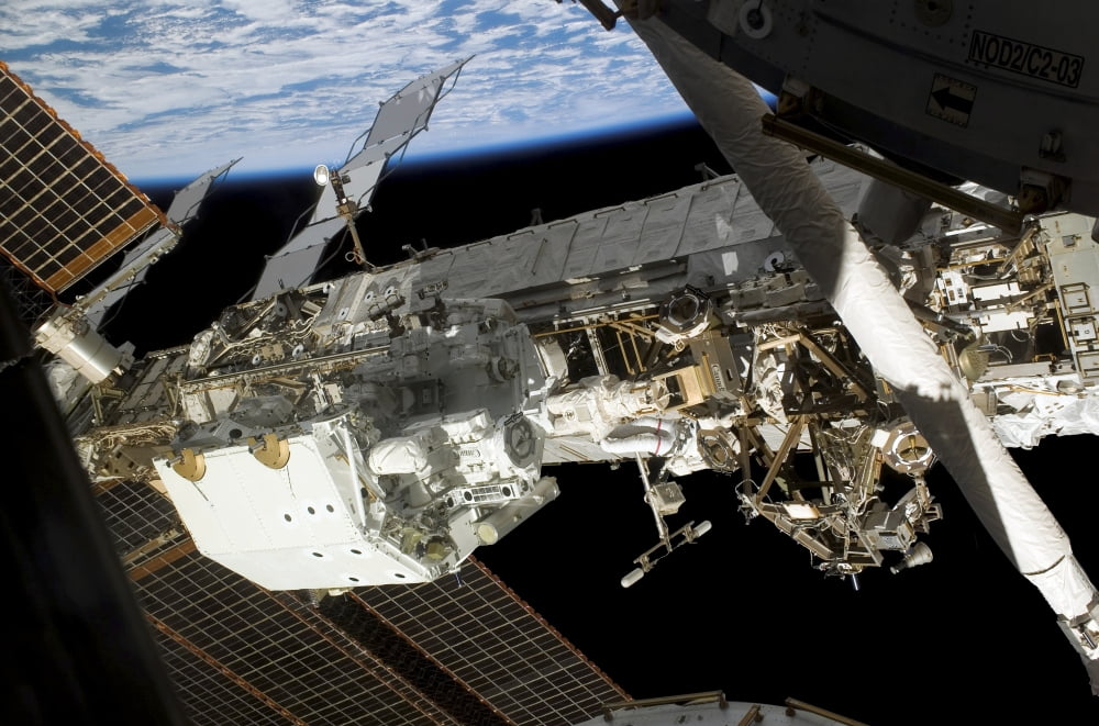 Astronaut participates in extravehicular activity Canvas Art - Stocktrek Images (34 x 23)