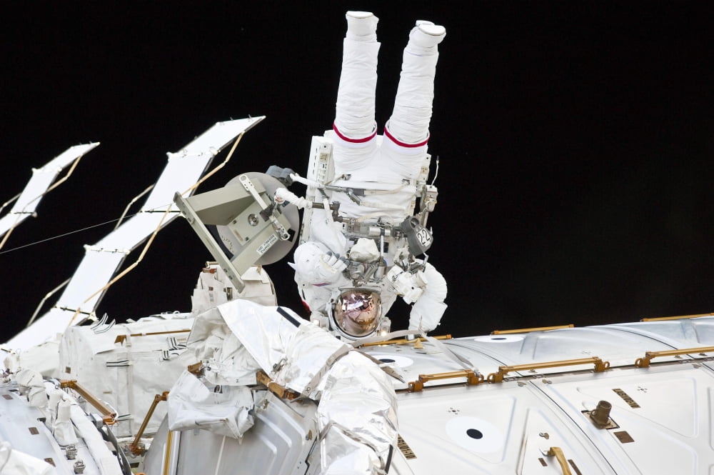 Astronaut participates in extravehicular activity Canvas Art - Stocktrek Images (34 x 23)