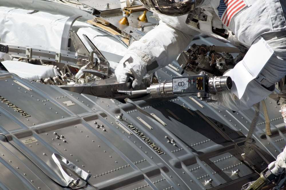 Astronaut participates in extravehicular activity Canvas Art - Stocktrek Images (34 x 23)