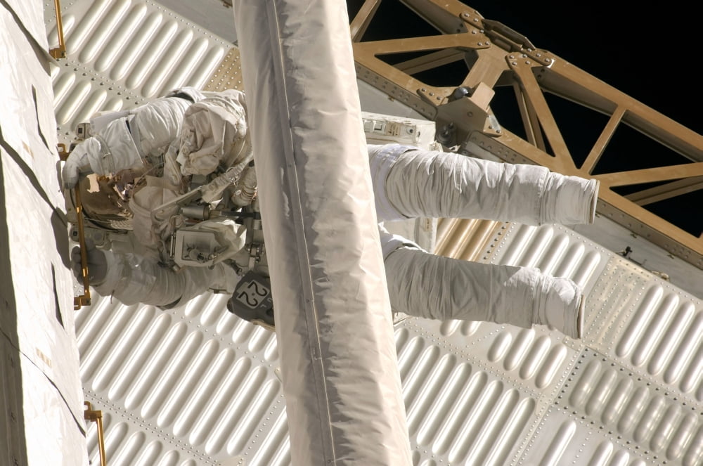 Astronaut participates in extravehicular activity Canvas Art - Stocktrek Images (34 x 23)