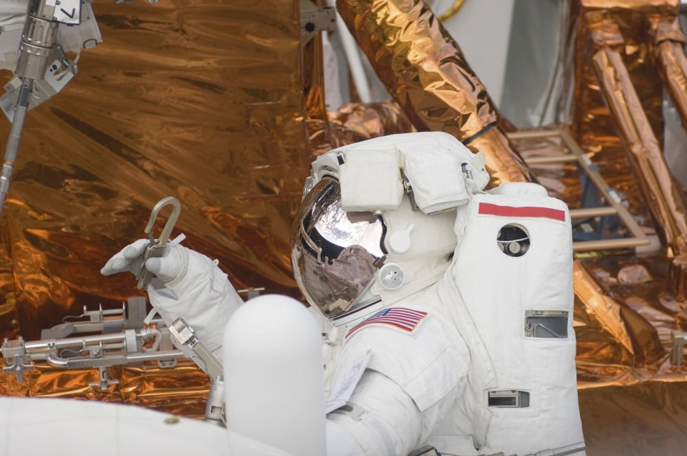 Astronaut participates in extravehicular activity Canvas Art - Stocktrek Images (34 x 23)