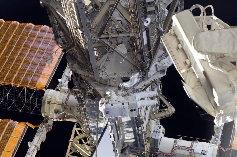 Astronaut participates in extravehicular activity Canvas Art - Stocktrek Images (34 x 23)