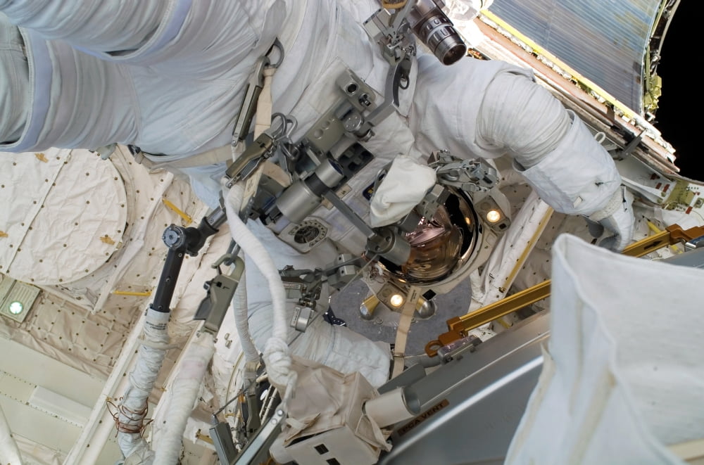 Astronaut participates in extravehicular activity Canvas Art - Stocktrek Images (34 x 23)