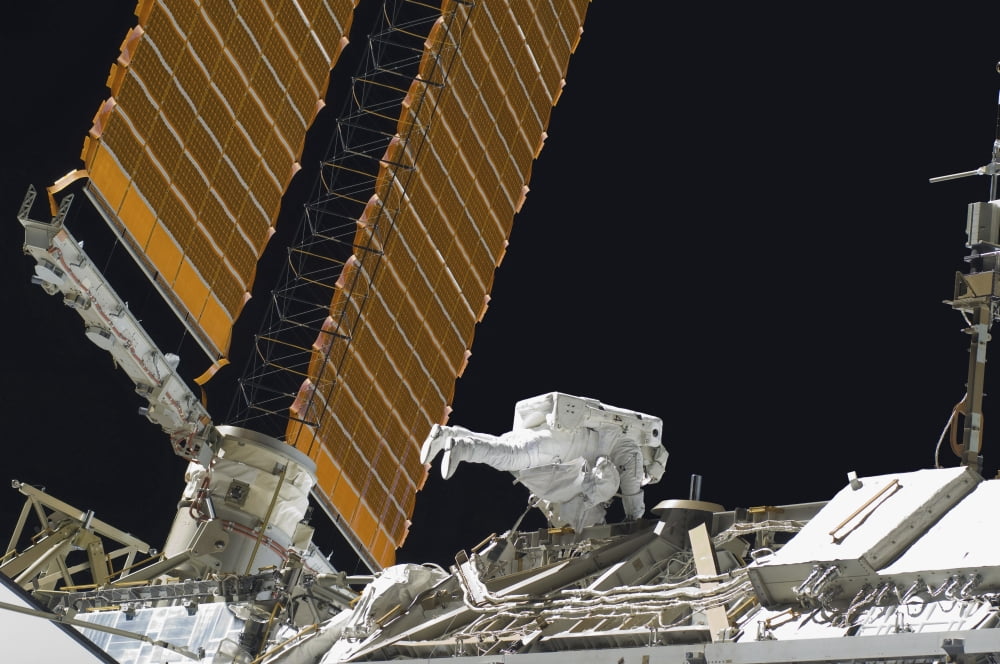 Astronaut participates in extravehicular activity Canvas Art - Stocktrek Images (34 x 23)