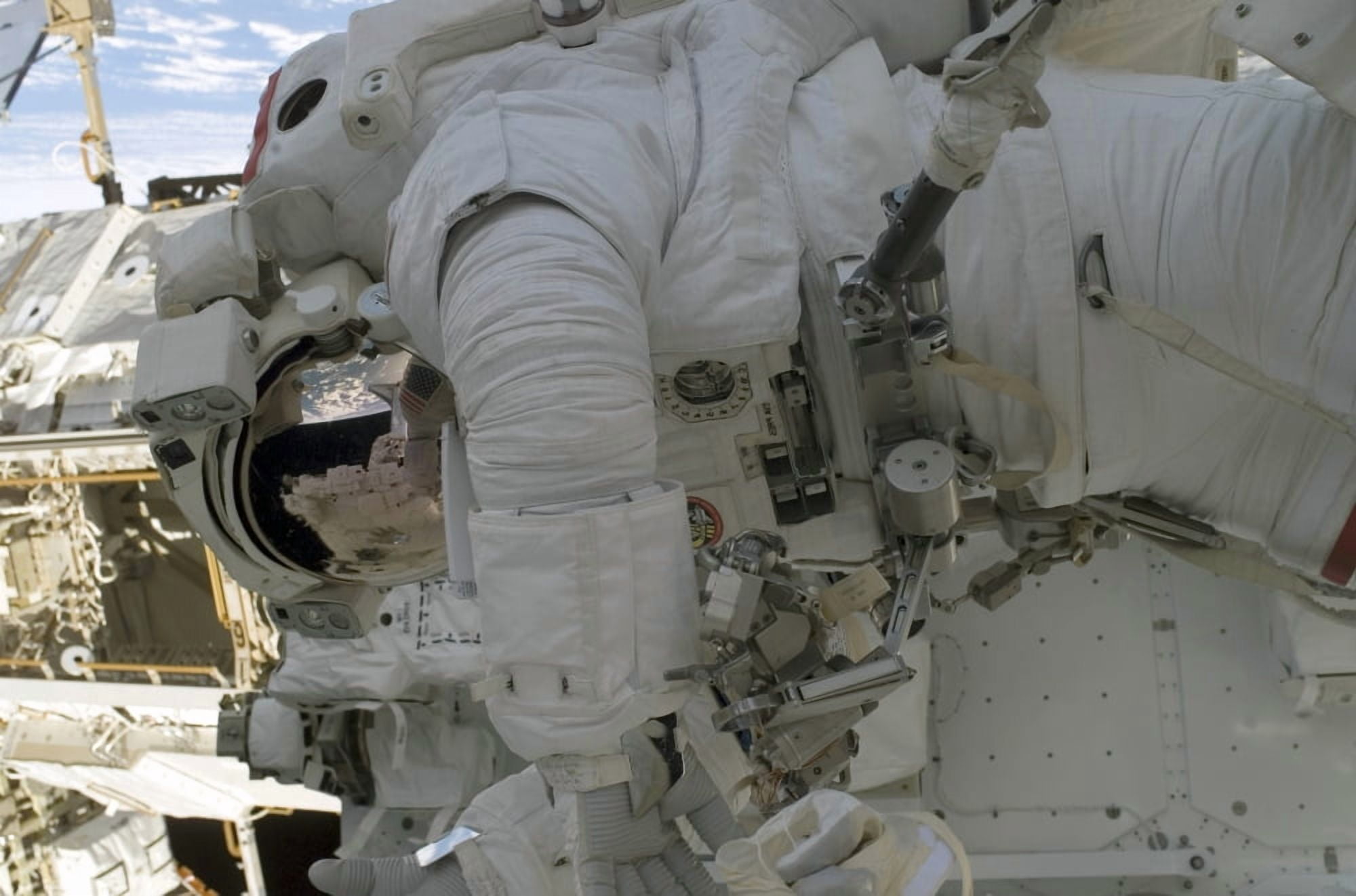 Astronaut participates in extravehicular activity Canvas Art - Stocktrek Images (34 x 23)