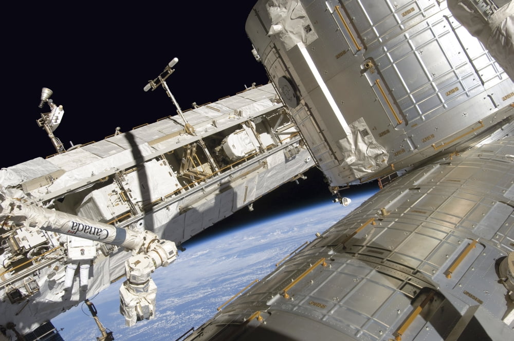 Astronaut participates in extravehicular activity Canvas Art - Stocktrek Images (35 x 23)