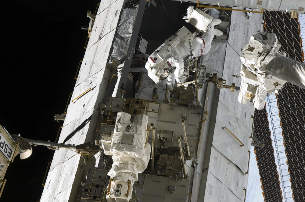 Astronaut participates in extravehicular activity Canvas Art - Stocktrek Images (35 x 23)