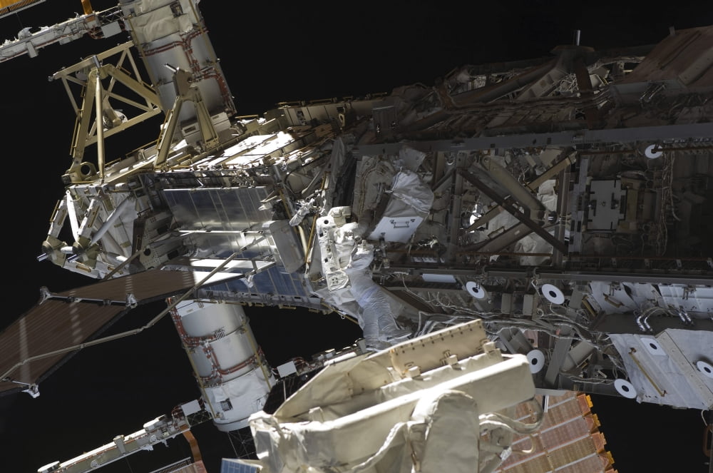 Astronaut participates in extravehicular activity Canvas Art - Stocktrek Images (35 x 23)