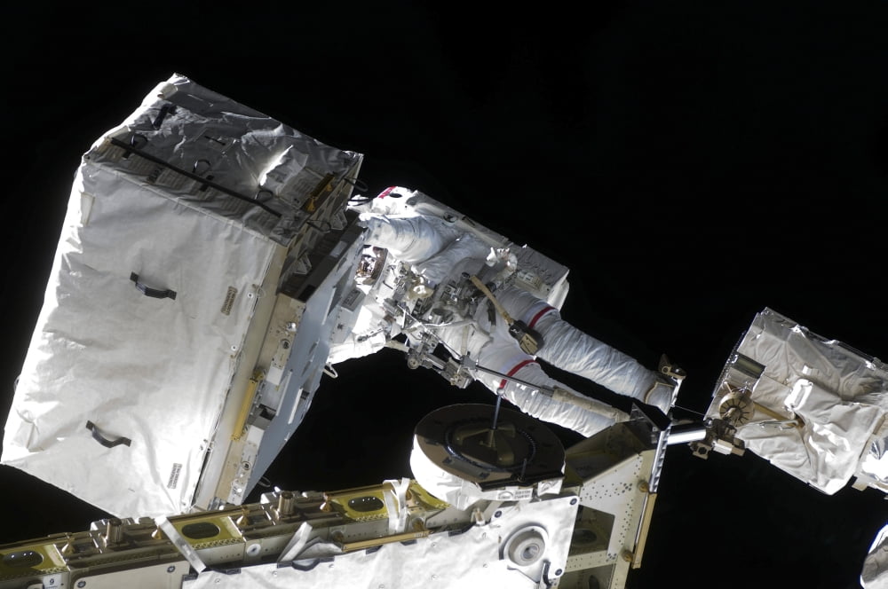 Astronaut participates in extravehicular activity Canvas Art - Stocktrek Images (35 x 23)