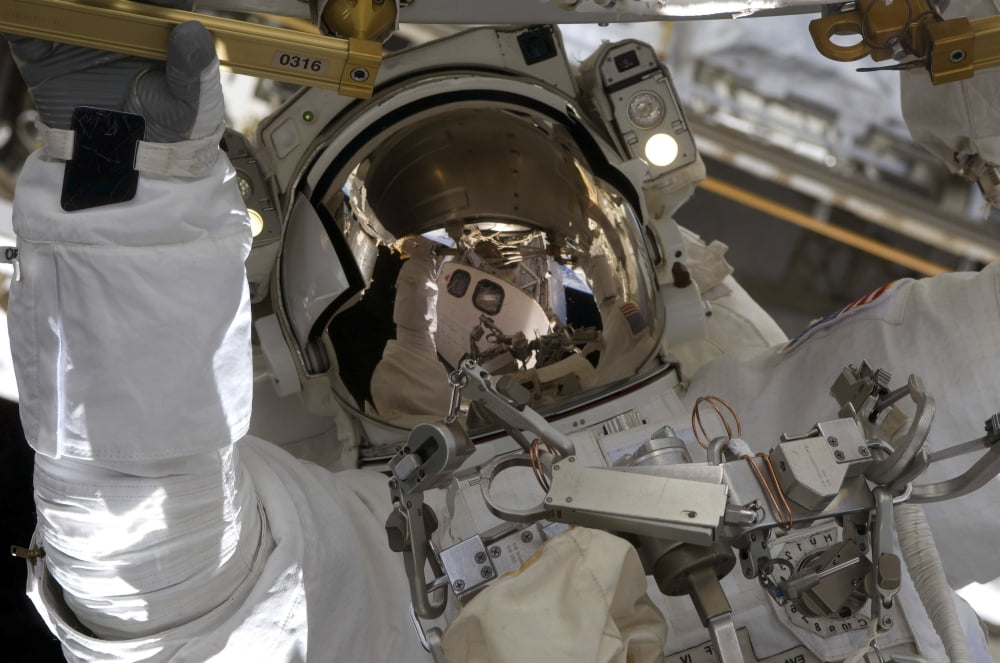 Astronaut participates in extravehicular activity Canvas Art - Stocktrek Images (35 x 23)