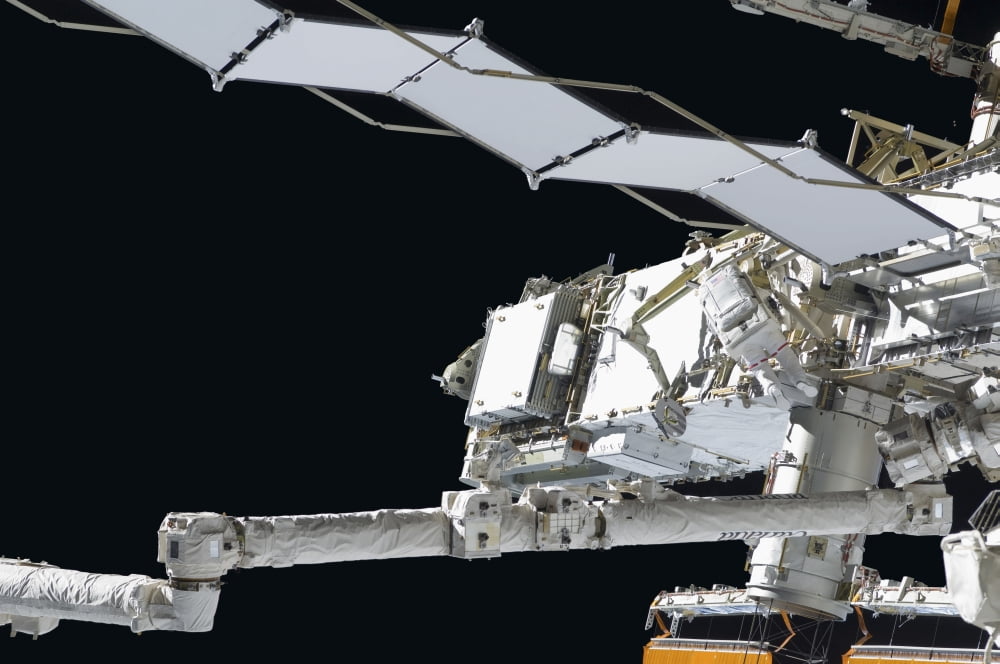 Astronaut participates in extravehicular activity Canvas Art - Stocktrek Images (35 x 23)