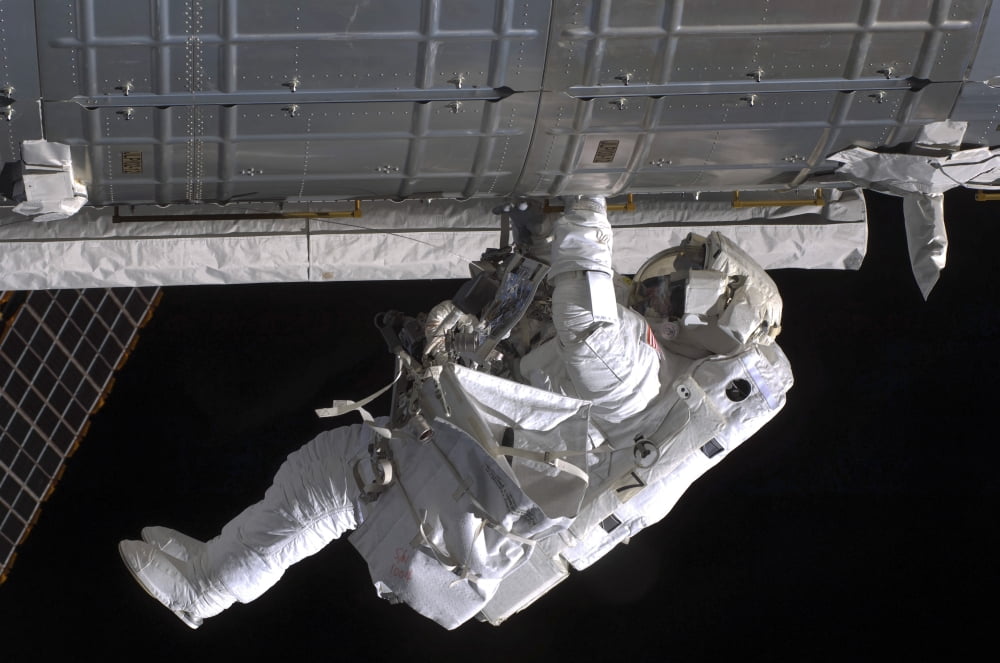 Astronaut participates in extravehicular activity Canvas Art - Stocktrek Images (35 x 23)