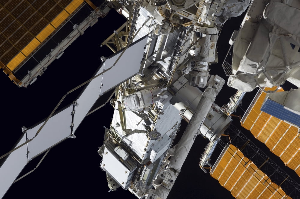 Astronaut participates in extravehicular activity Canvas Art - Stocktrek Images (35 x 23)