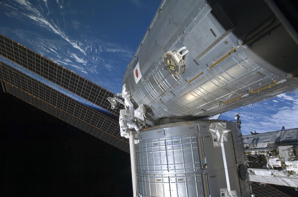 Astronaut participates in extravehicular activity Canvas Art - Stocktrek Images (35 x 23)