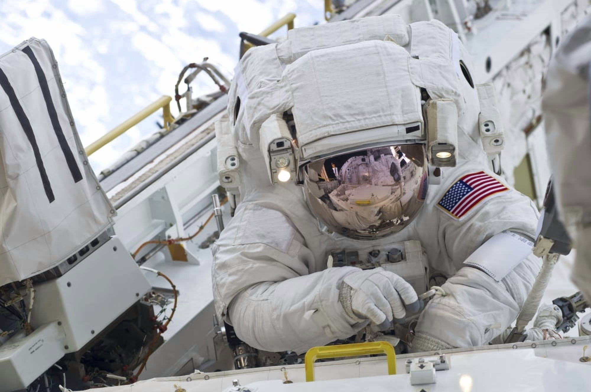 Astronaut participates in a session of extravehicular activity (EVA) as construction and maintenance continue on the International Space Station Canvas Art - Stocktrek Images (34 x 23)