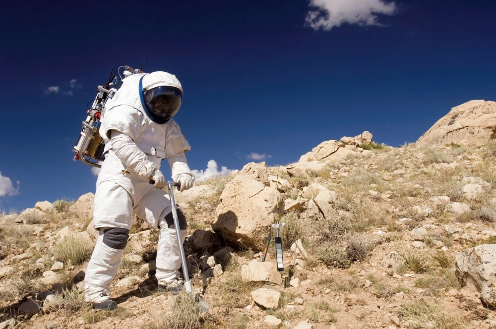 Astronaut stands beside a core sampling tool Canvas Art - Stocktrek Images (34 x 23)